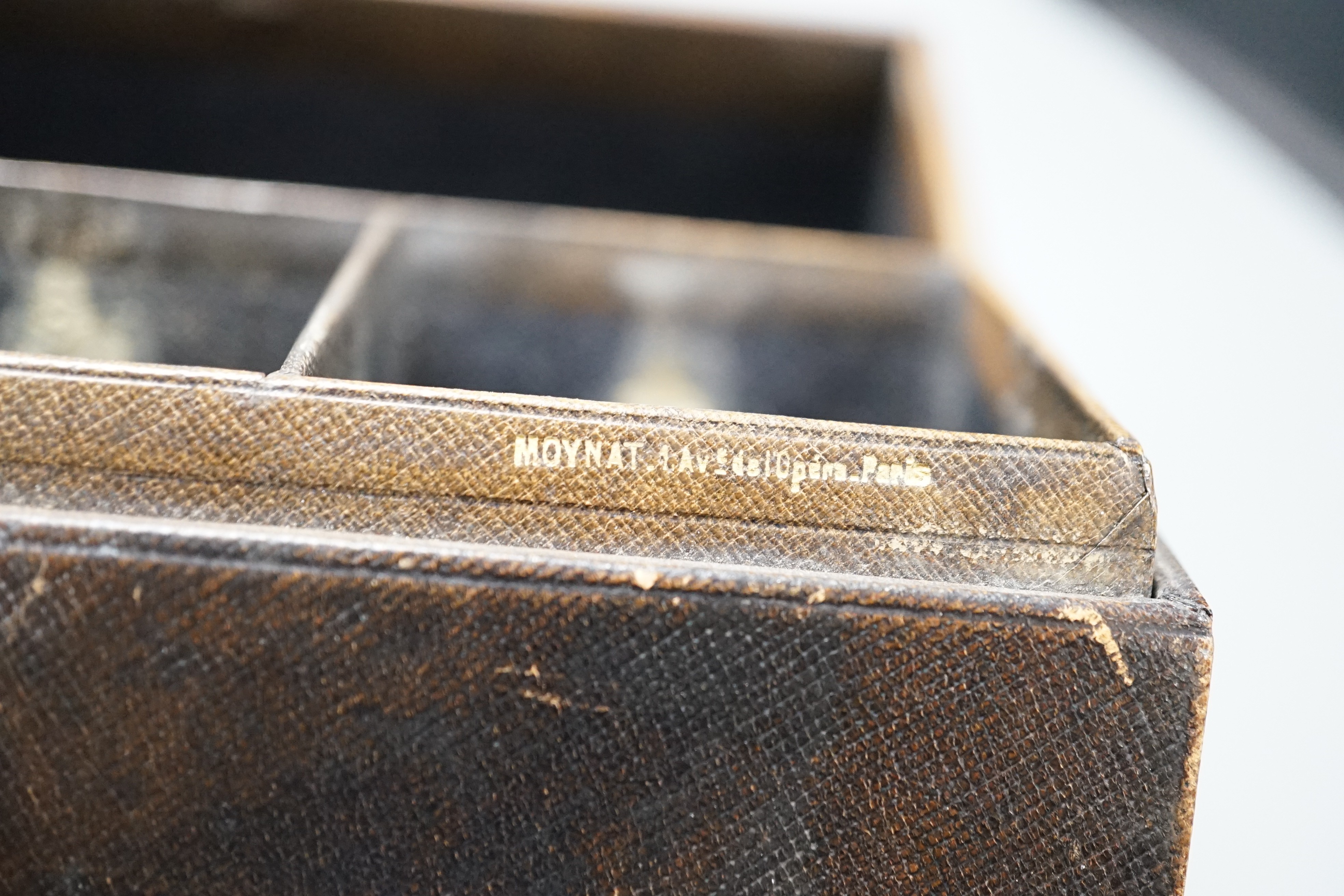 A mid 20th century Moynat Paris travelling triple scent bottle case, 18cm wide